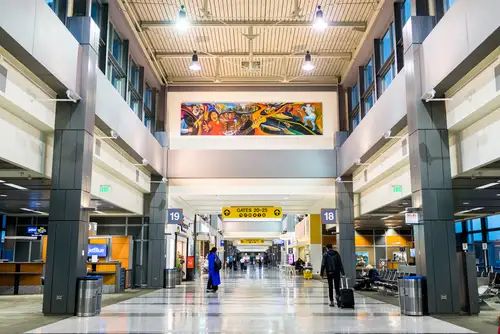 AUSTIN - CIRCA MARCH 2017: Travelers walk through an airport terminal at the Bergstrom International airport in Austin,Texas.